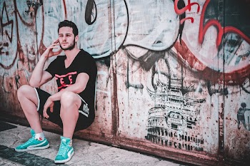 Man Leaning on Wall