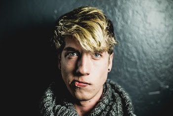 Man Leaning on Wall