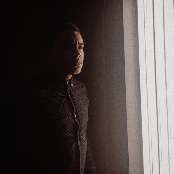 Man Leaning on Wall