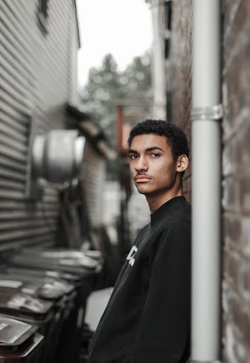 Man Leaning on Wall
