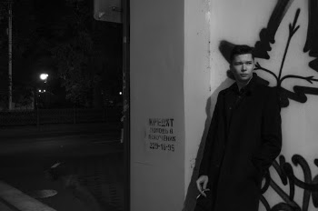 Man Leaning on Wall