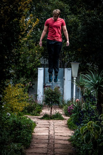 Man Levitate Surrounded by Trees