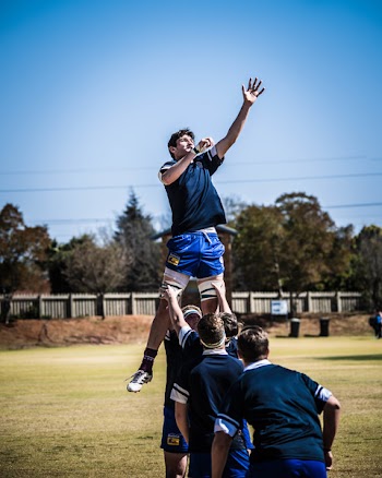 Man Lifted by His Teammate