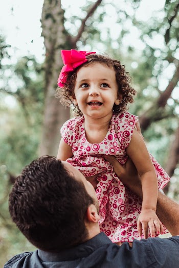 Man Lifting Girl Up