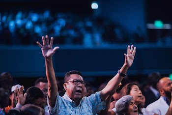 Man Lifting His Arms
