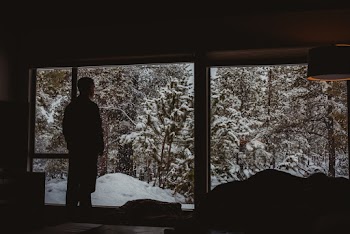Man Looking Out A Window