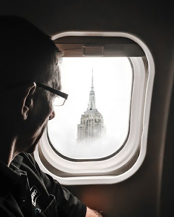 Man Looking Out Aircraft Window