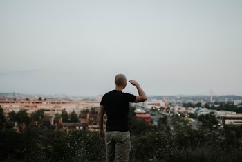 Man Looking Towards the City