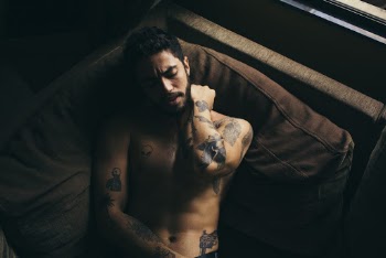Man Lying on Brown Textile