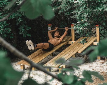 Man Lying on Brown Wooden Board