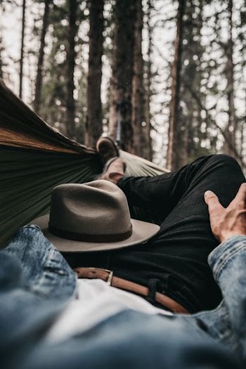 man lying on hammock