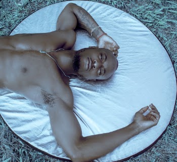 Man Lying on Light Reflector