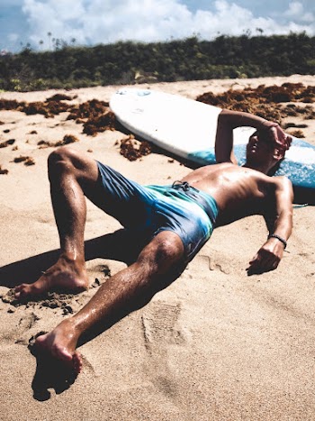 Man Lying on Sand