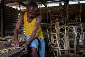 Man making a rattan furniture, | Free Photo - rawpixel