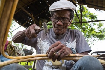 Man making a rattan furniture, | Free Photo - rawpixel