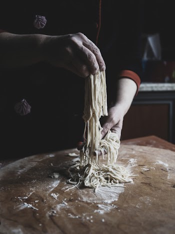 Man making homemade spaghetti 