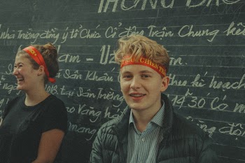 Man Near Chalk Board With Text