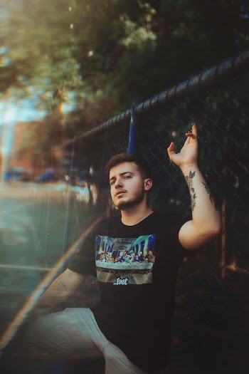Man Near Fence
