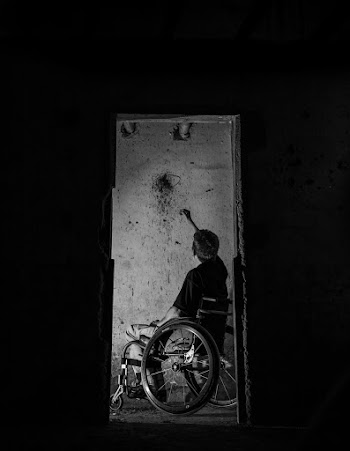 Man On A Wheelchair