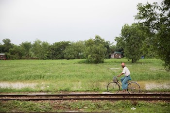 Man On Bike Near Tracks