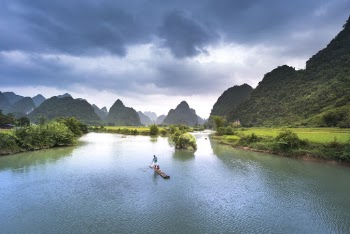 Man On Boat In Lake