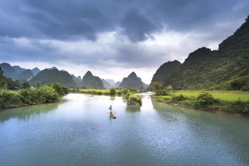 Man On Boat In Lake