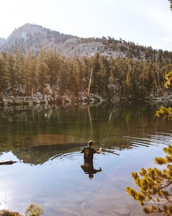 man on lake during daytime