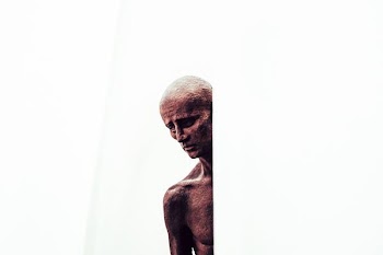 man on white wall