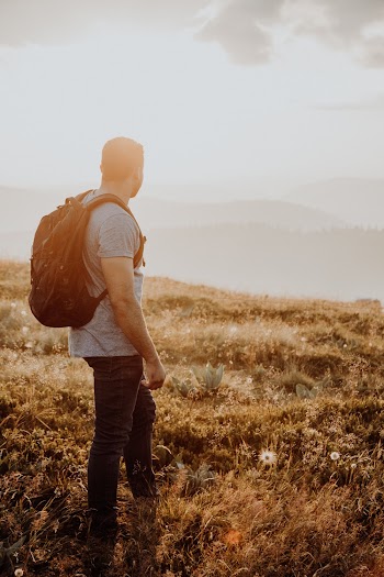 Man Overlooking The Mountains