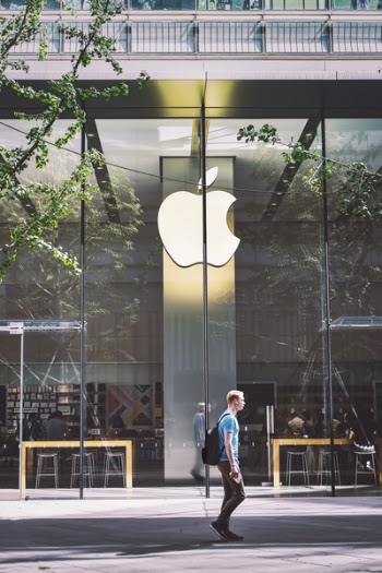 Man Passing An Apple Store