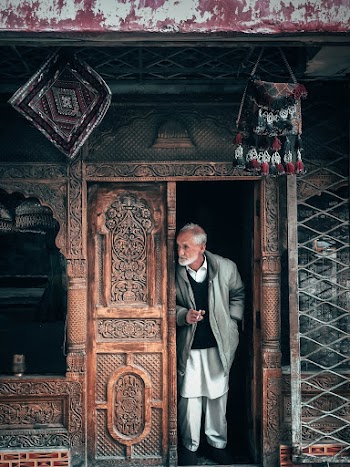 Man Peeking Behind Doors