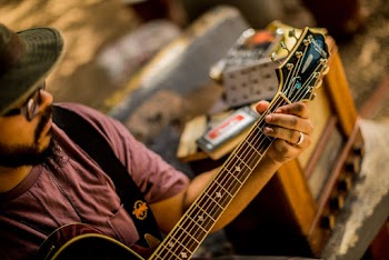 Man Playing A Guitar