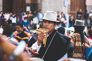 Man Playing Bamboo Wind Instrument