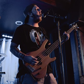 Man Playing Bass Electric Guitar