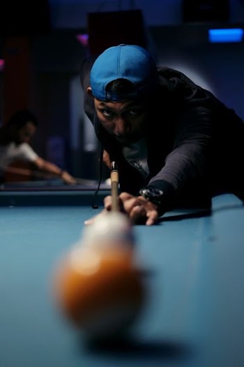 man playing billiard