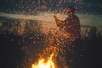 man playing bone fire