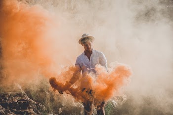 Man Playing Color Powders