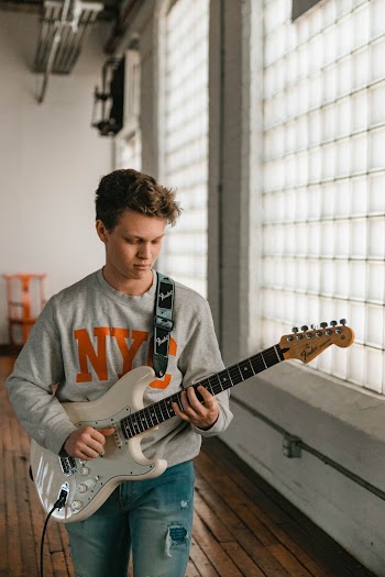 Man Playing Electric Guitar