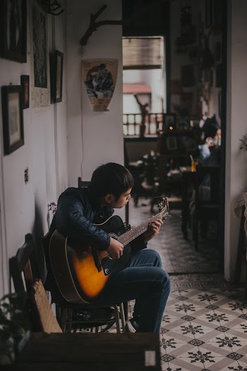 Man Playing Guitar