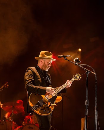 Man Playing Guitar on Stage