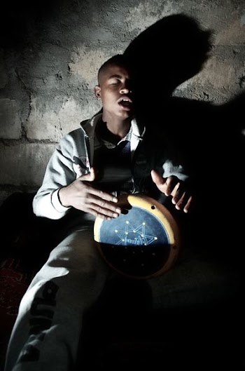 man playing percussion instrument near wal