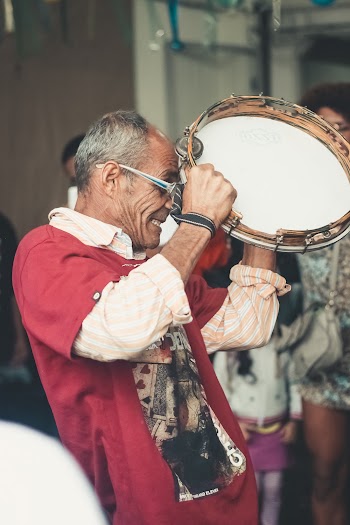 Man Playing Tambourine