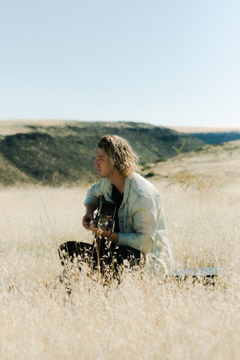 Man Playing the Guitar