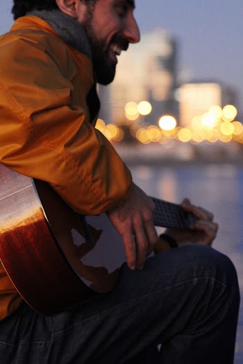 Man Playing The Guitar