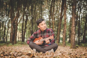 Man Playing Ukulele