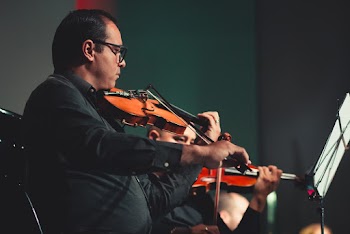 Man Playing Violin on Stage