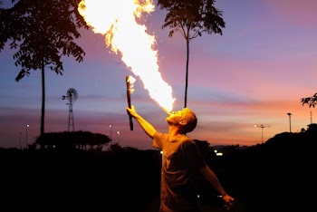 Man Playing With Fire