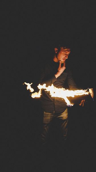 man playing with fire
