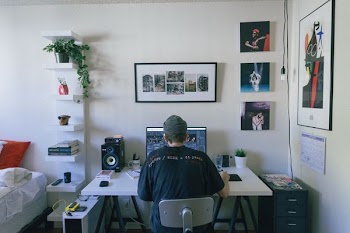 man playing with his computer