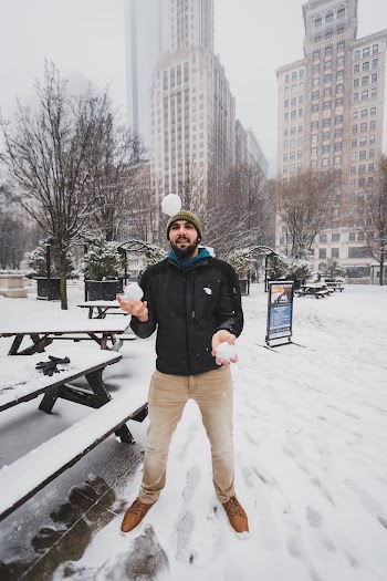 Man Playing With Snowballs